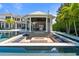 Fire pit with built in seating and pool view at 9343 Tibet Pointe Cir, Windermere, FL 34786