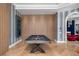 Game room featuring a stylish pool table and wood wall paneling at 9343 Tibet Pointe Cir, Windermere, FL 34786