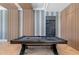 Game room with a pool table, wood wall paneling and herringbone floors at 9343 Tibet Pointe Cir, Windermere, FL 34786