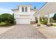 Attached garage with paver driveway and covered walkway at 9343 Tibet Pointe Cir, Windermere, FL 34786