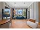 Gathering room boasts herringbone floors, a blue sofa, and large windows at 9343 Tibet Pointe Cir, Windermere, FL 34786