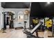 Well-equipped home gym with various weight machines and cardio equipment at 9343 Tibet Pointe Cir, Windermere, FL 34786