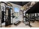 Home gym with various weight training equipment and cardio machines at 9343 Tibet Pointe Cir, Windermere, FL 34786