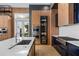 Spacious kitchen featuring wood and blue cabinetry, and island at 9343 Tibet Pointe Cir, Windermere, FL 34786