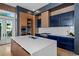 Modern kitchen with a large island, ample cabinetry, and top-of-the-line appliances at 9343 Tibet Pointe Cir, Windermere, FL 34786
