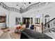 Grand two-story living room featuring a piano, stylish seating, and a modern design at 9343 Tibet Pointe Cir, Windermere, FL 34786