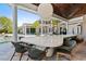 Long outdoor dining table with seating for many guests at 9343 Tibet Pointe Cir, Windermere, FL 34786
