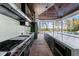 Outdoor kitchen features stainless steel appliances and a large island at 9343 Tibet Pointe Cir, Windermere, FL 34786