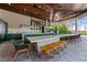 Outdoor kitchen with seating area and lake view at 9343 Tibet Pointe Cir, Windermere, FL 34786