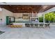 Modern outdoor kitchen with grill, pizza oven, and large island at 9343 Tibet Pointe Cir, Windermere, FL 34786