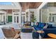 Covered patio features comfortable seating, and wood ceiling at 9343 Tibet Pointe Cir, Windermere, FL 34786