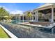 Luxury pool and fire pit with built-in seating at 9343 Tibet Pointe Cir, Windermere, FL 34786