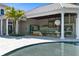 Outdoor kitchen and pool area with modern design at 9343 Tibet Pointe Cir, Windermere, FL 34786