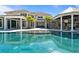 Large pool with a luxurious, modern home in background at 9343 Tibet Pointe Cir, Windermere, FL 34786