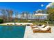 Relaxing poolside view overlooking a serene lake at 9343 Tibet Pointe Cir, Windermere, FL 34786