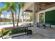 Relaxing patio with wooden bench and ping pong table at 9343 Tibet Pointe Cir, Windermere, FL 34786