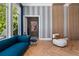 Sitting area features a comfortable blue sofa and hardwood floors at 9343 Tibet Pointe Cir, Windermere, FL 34786