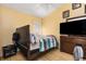 Bedroom with double bed, dresser, and window at 12618 Lynchburg Ct, Orlando, FL 32837