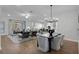 Open concept dining area with hardwood floors and modern chandelier at 14279 Crest Palm Ave, Windermere, FL 34786