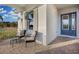 Covered porch with seating area and brick pavers at 14279 Crest Palm Ave, Windermere, FL 34786