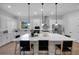 Large kitchen island with white cabinets and quartz countertops at 14279 Crest Palm Ave, Windermere, FL 34786
