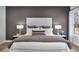 Main bedroom with plush bed and gray accent wall at 14279 Crest Palm Ave, Windermere, FL 34786