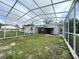 Screened patio overlooking the backyard at 1625 Normandy Way, Leesburg, FL 34748