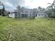 Large backyard with screened enclosure and shed at 1625 Normandy Way, Leesburg, FL 34748