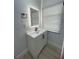 Modern bathroom with white vanity and black accents at 1625 Normandy Way, Leesburg, FL 34748