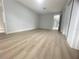 Bright and airy bedroom with wood-look floors at 1625 Normandy Way, Leesburg, FL 34748