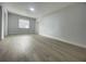 Spacious bedroom with light walls and wood-look floors at 1625 Normandy Way, Leesburg, FL 34748