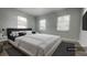 Spacious bedroom with king-size bed and stylish rug at 1625 Normandy Way, Leesburg, FL 34748