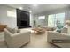 Bright living room features a modern fireplace and comfortable seating at 1625 Normandy Way, Leesburg, FL 34748