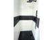 Clean shower with black and white tile at 1625 Normandy Way, Leesburg, FL 34748
