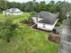 House with a large yard and another house visible in the background at 19230 Sheldon St, Orlando, FL 32833