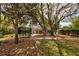 House exterior surrounded by mature trees and landscaping at 19230 Sheldon St, Orlando, FL 32833