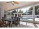 Enjoy a screened patio with dining area overlooking the pool and spa at 19230 Sheldon St, Orlando, FL 32833