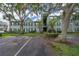 Exterior of a three-story green apartment building with designated parking spaces and landscaping at 2007 Dixie Belle Dr # 2007A, Orlando, FL 32812
