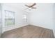 Bright bedroom with wood-look flooring and ceiling fan at 2007 Dixie Belle Dr # 2007A, Orlando, FL 32812