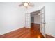 Empty bedroom with French doors, wood floors, and ceiling fan at 2007 Dixie Belle Dr # 2007A, Orlando, FL 32812