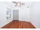 Bright bedroom with wood floors, ceiling fan, and closet with shutters at 2007 Dixie Belle Dr # 2007A, Orlando, FL 32812