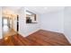 Dining area with polished wood floors and an open view into the kitchen at 2007 Dixie Belle Dr # 2007A, Orlando, FL 32812