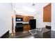 Kitchen with dark granite countertops and stainless steel appliances at 2007 Dixie Belle Dr # 2007A, Orlando, FL 32812