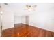Living room or additional bedroom with wood floors, white walls, and ceiling fan at 2007 Dixie Belle Dr # 2007A, Orlando, FL 32812