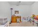 bedroom featuring a desk and chair, ideal for homework at 2325 Crossandra St, Mascotte, FL 34753