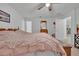 Comfortable bedroom with a large bed and plenty of space at 2325 Crossandra St, Mascotte, FL 34753