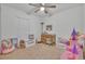 Bright bedroom with plenty of space for toys and a study area at 2325 Crossandra St, Mascotte, FL 34753