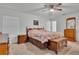 Spacious bedroom with ample natural light and wooden furniture at 2325 Crossandra St, Mascotte, FL 34753