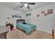 Cozy bedroom with a double bed and ceiling fan at 2325 Crossandra St, Mascotte, FL 34753
