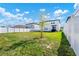 Large backyard with green lawn and white fence at 2362 Lancashire St, Davenport, FL 33896